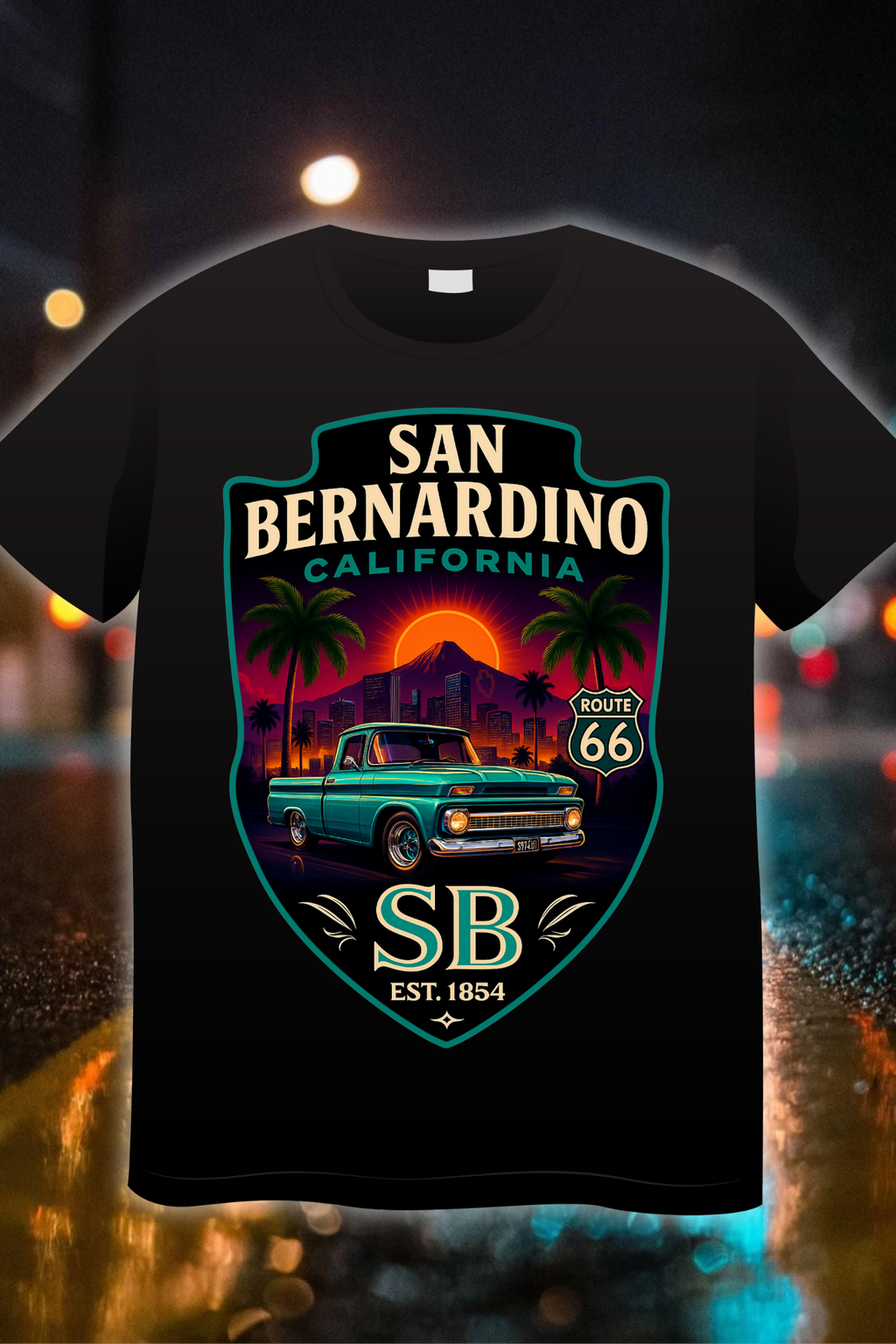 “San Bernardino Route 66 Edition t-shirt featuring a classic green truck, palm trees, and sunset badge design”
