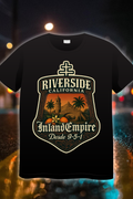 Riverside Inland Empire 951 Edition t-shirt featuring historic landmark artwork with palm trees and golden tones 951